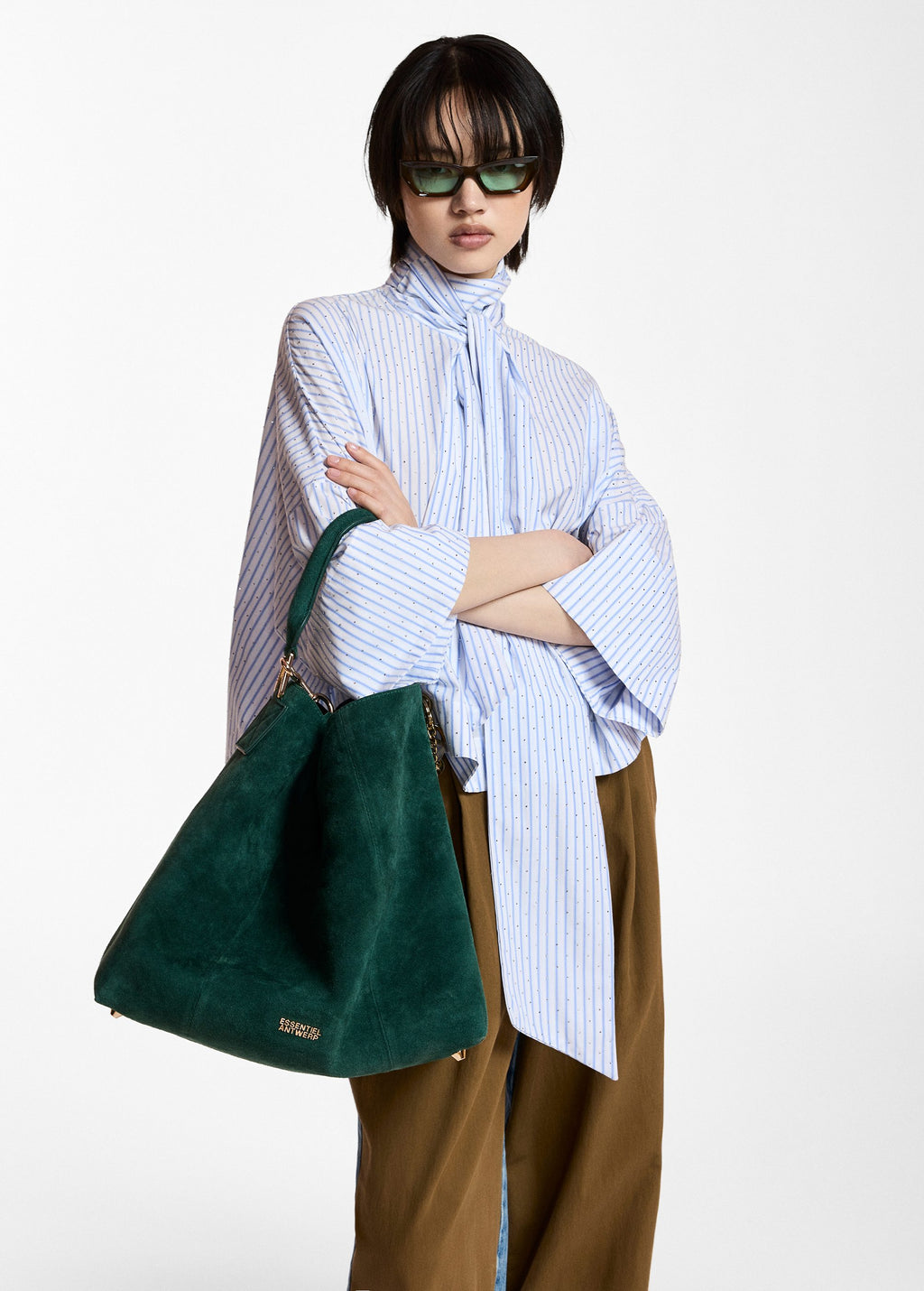 Pussy-bow top with trumpet sleeves and light blue and white stripes