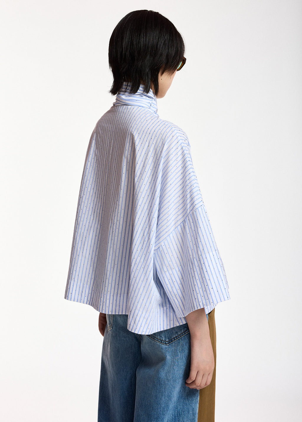 Pussy-bow top with trumpet sleeves and light blue and white stripes