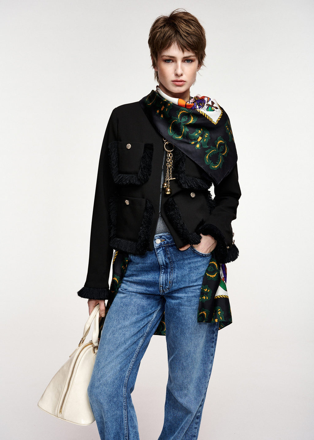 Black fitted jacket with fringed details and patch pockets