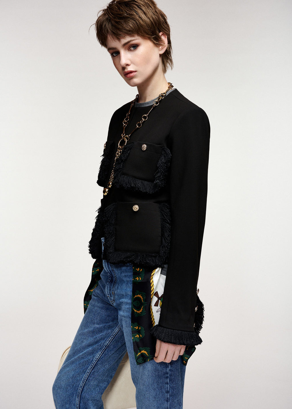 Black fitted jacket with fringed details and patch pockets