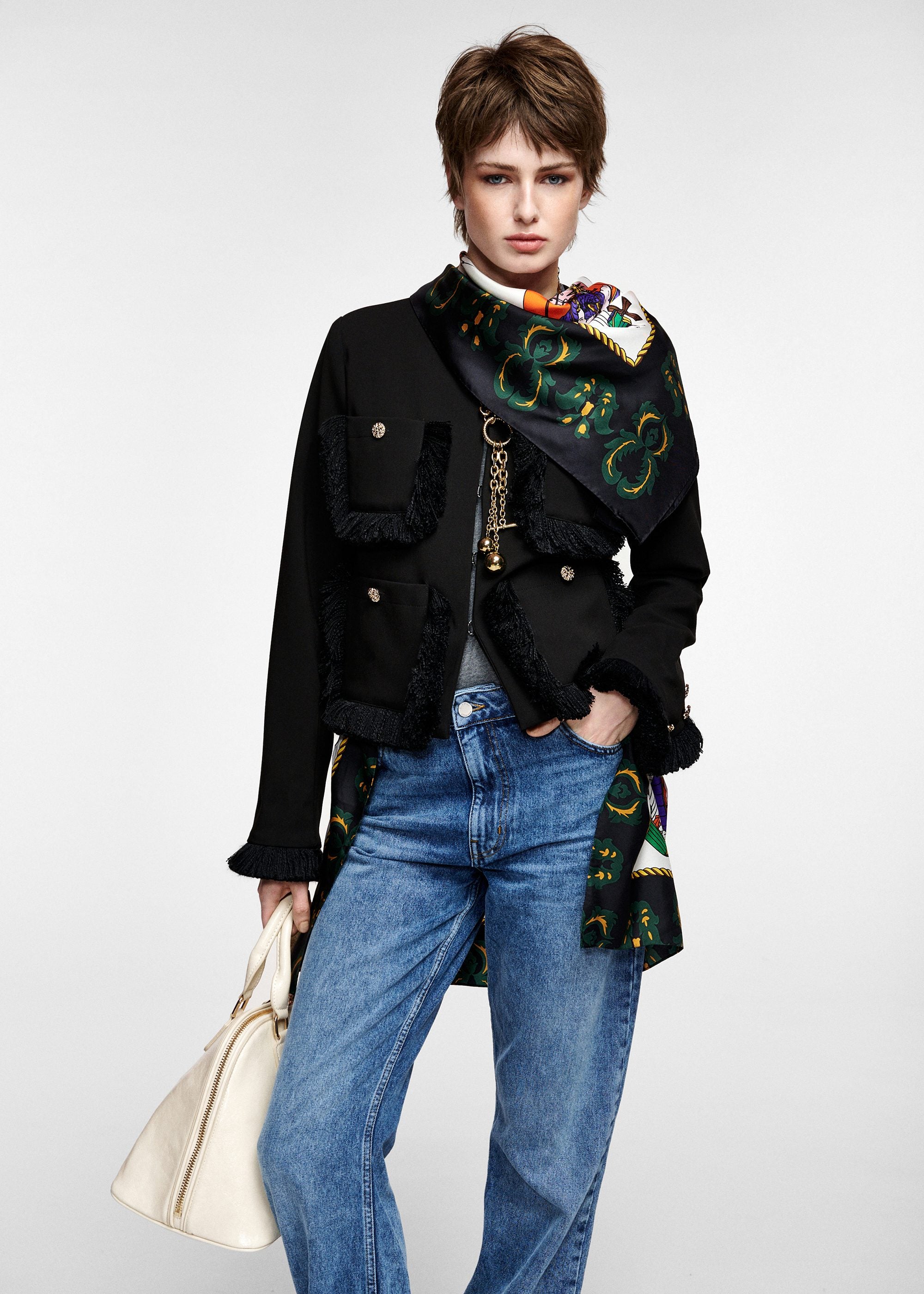 Black fitted jacket with fringed details and patch pockets