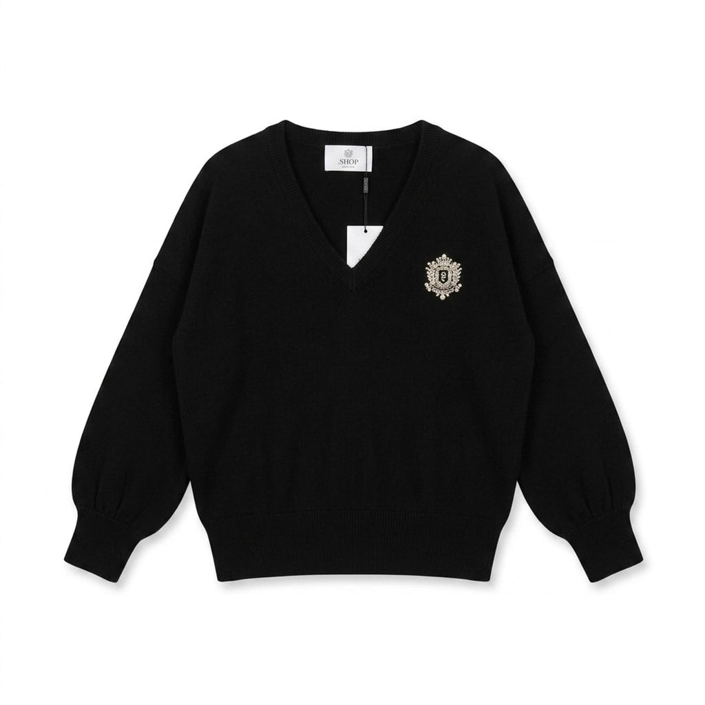 Pull Perle noir avec bijoux au niveau de la poche